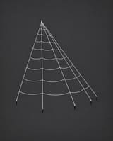 Giant white fan-shaped Halloween spider web with five ground stakes, shown against a charcoal background