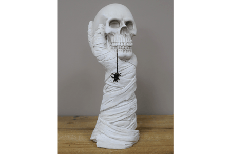 Hand Holding Skull Ornament