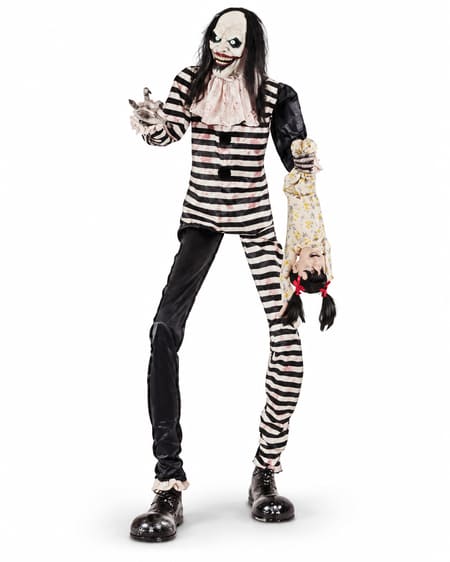 Sweet Dreams clown animatronic in asymmetric black and white striped costume holding an upside-down prop doll