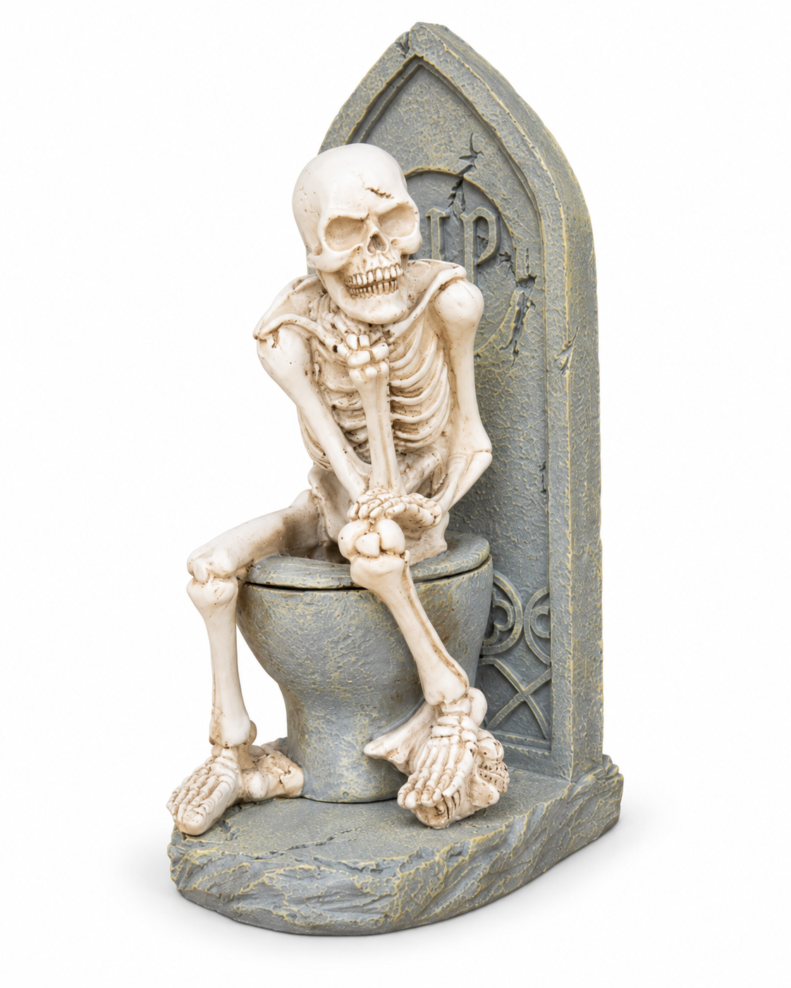 Skeleton sitting on a Gothic stone-look toilet ornament on white background