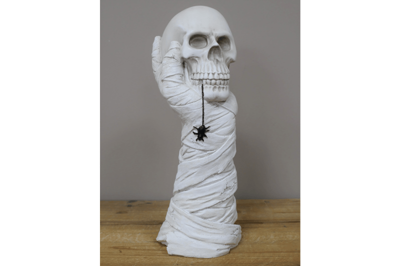 Hand Holding Skull Ornament