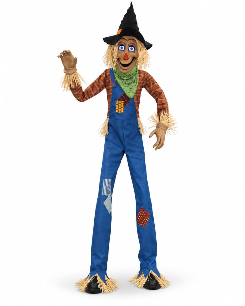 Towering scarecrow animatronic with blue illuminated eyes, pointed black hat, green neckerchief, plaid shirt and patched blue dungarees