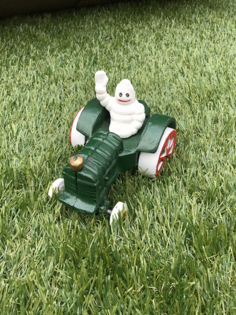 Cast Iron Michelin Man on Tractor