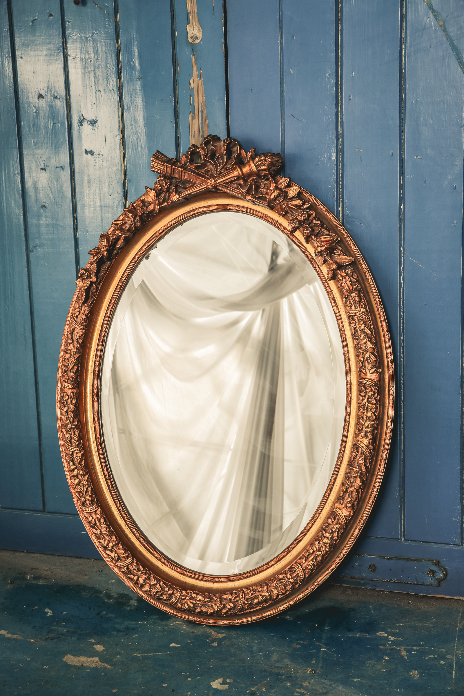 MR007 Gilt Oval Mirror with Torch Detail