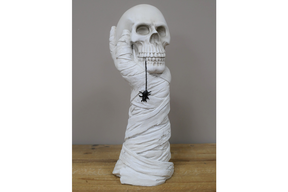 Hand Holding Skull Ornament