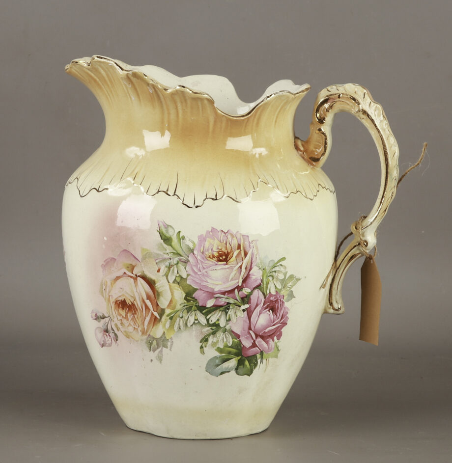 A pitcher with a floral pattern