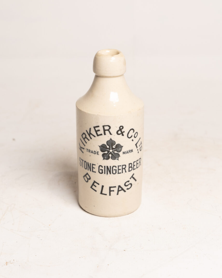 A white stoneware bottle with the Kirker & Co logo on it