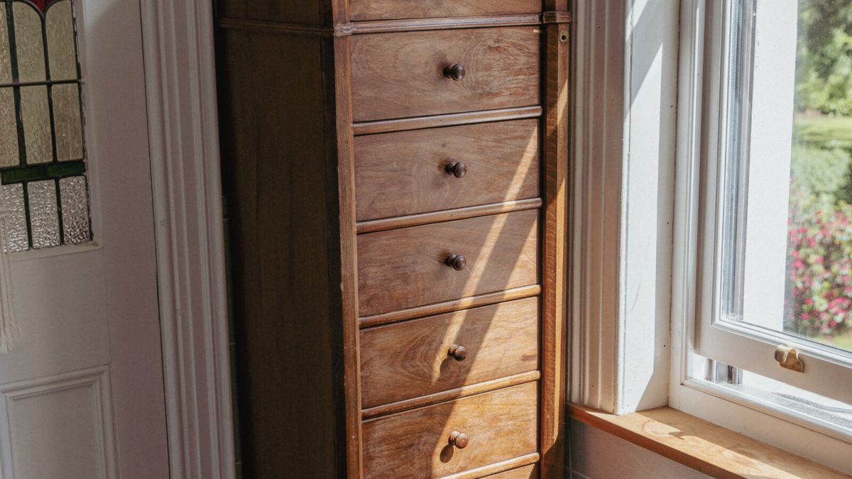 A tall set of wooden drawers.