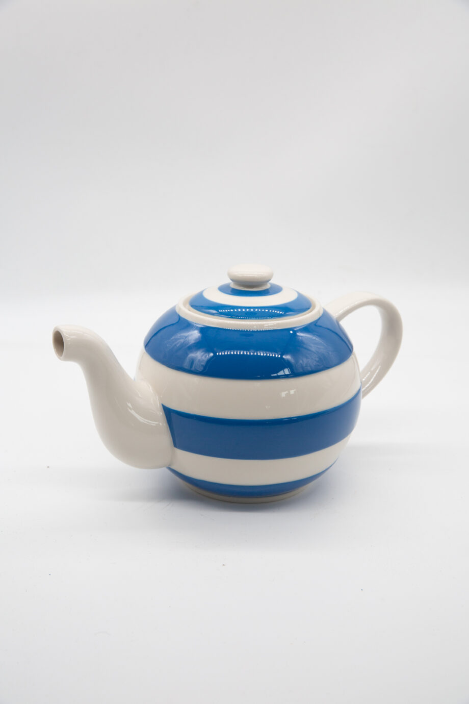 A blue and white striped teapot