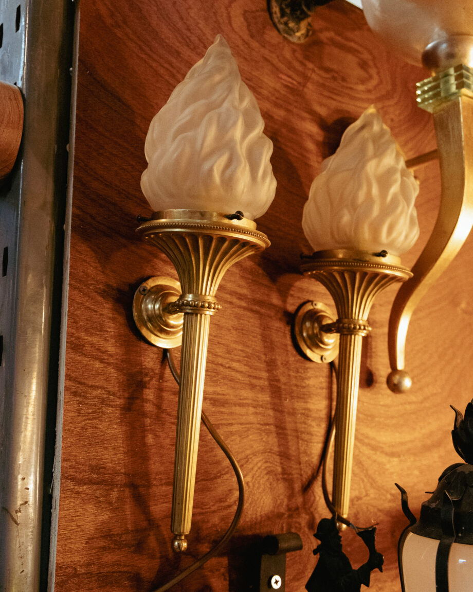 Two gold torch style sconces 