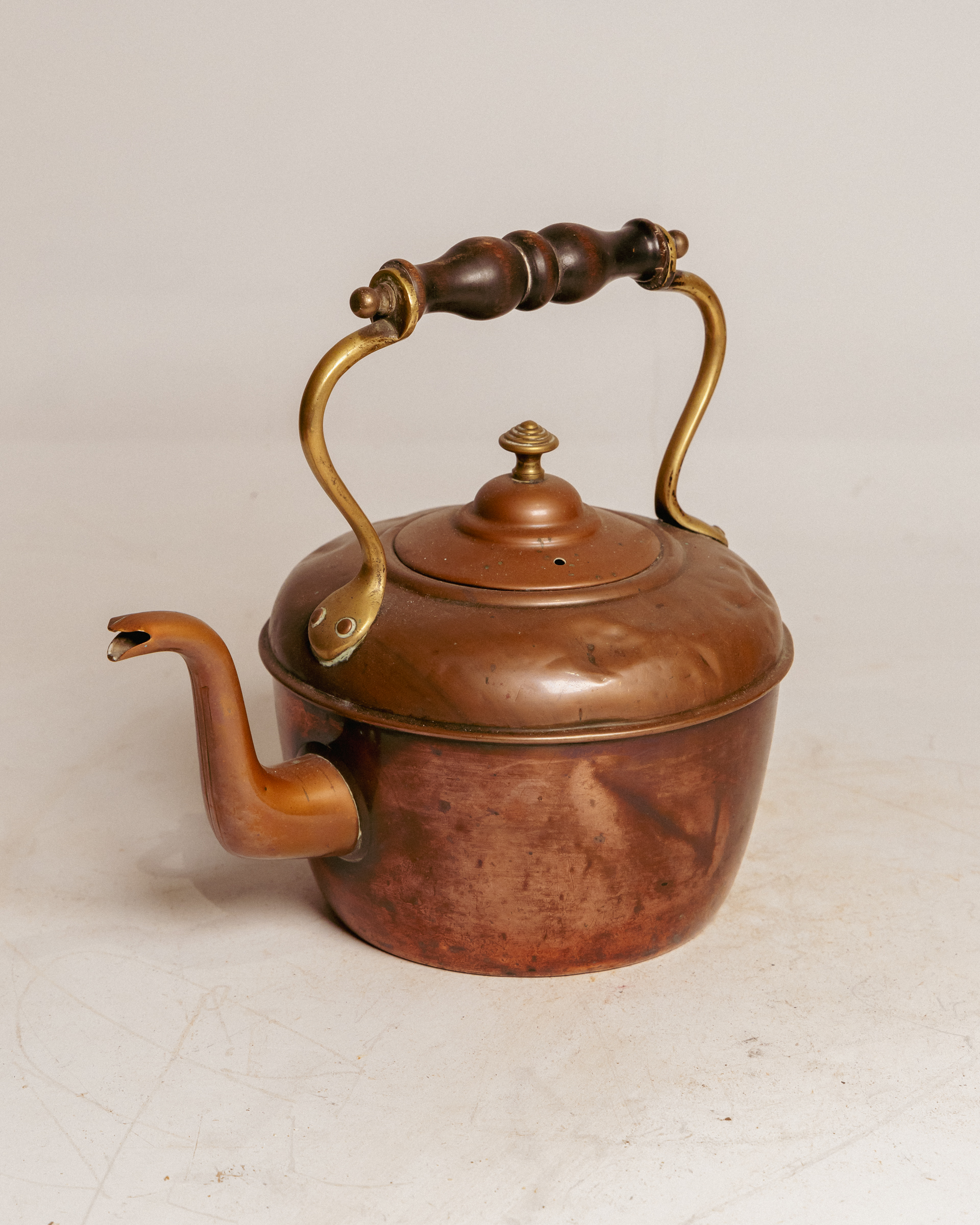 Copper kettle with wooden handle