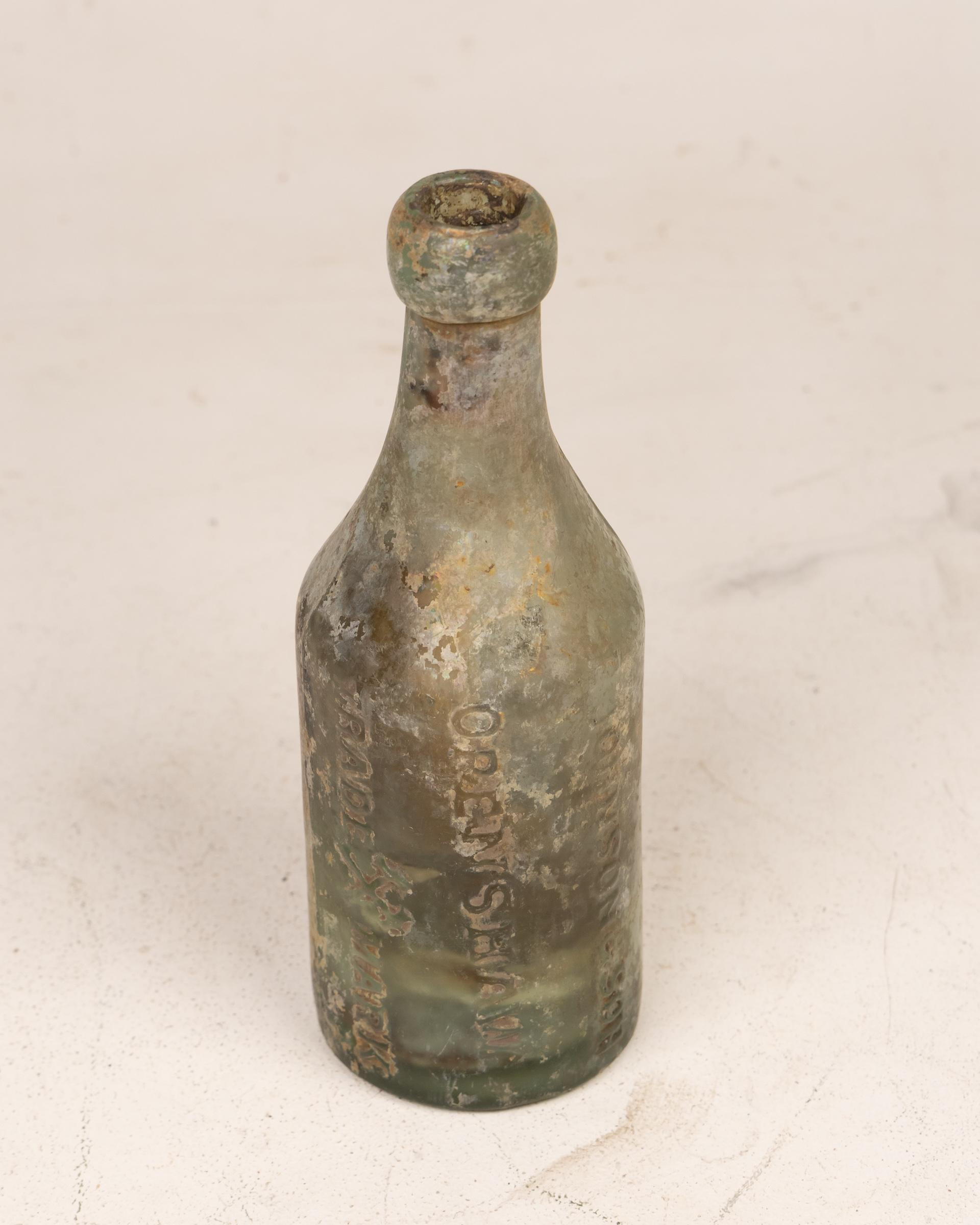 E. Johnson Openshaw Glass Bottle