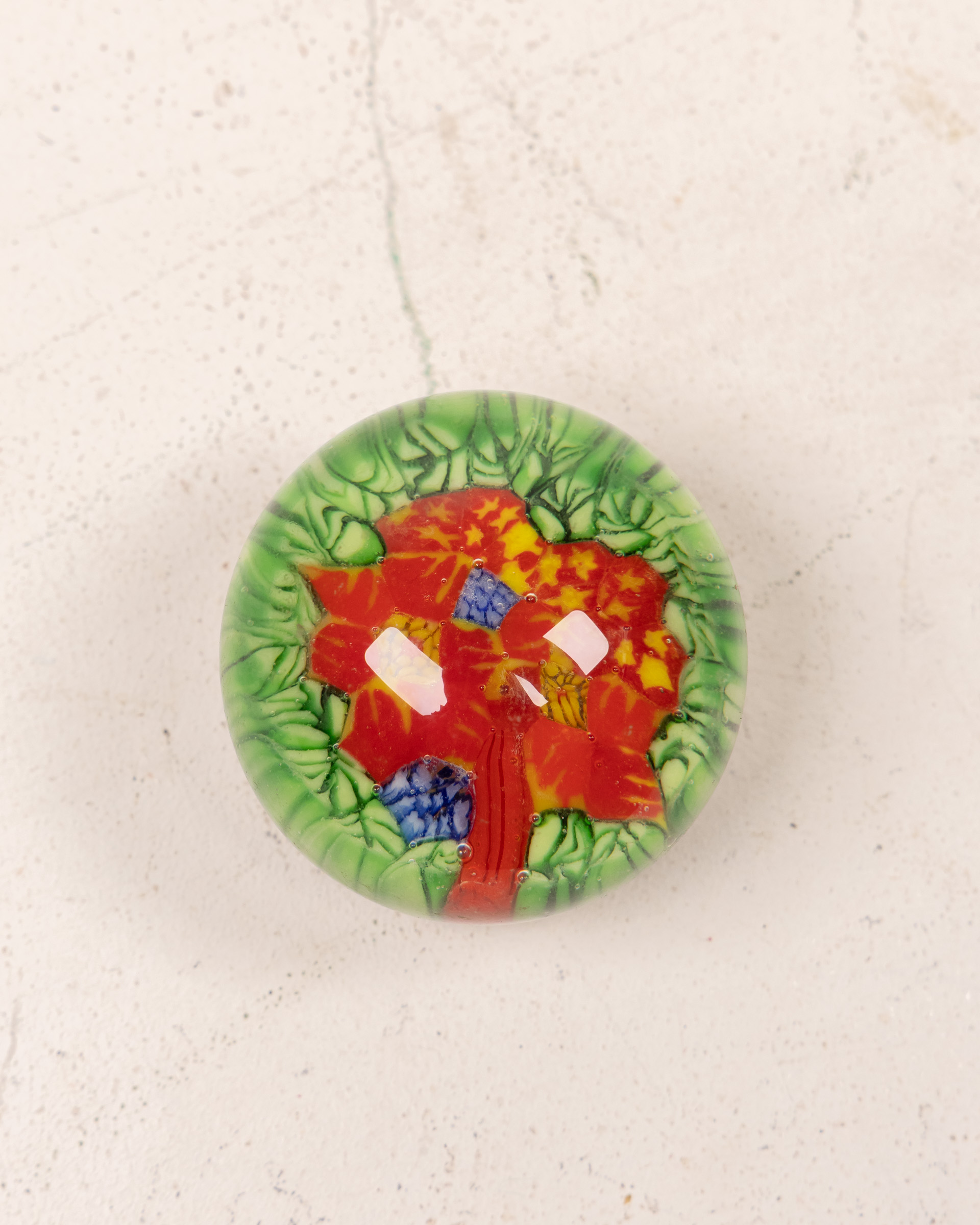 Vintage Glass Paperweight with Embedded Red Flower and Green Leaf Design