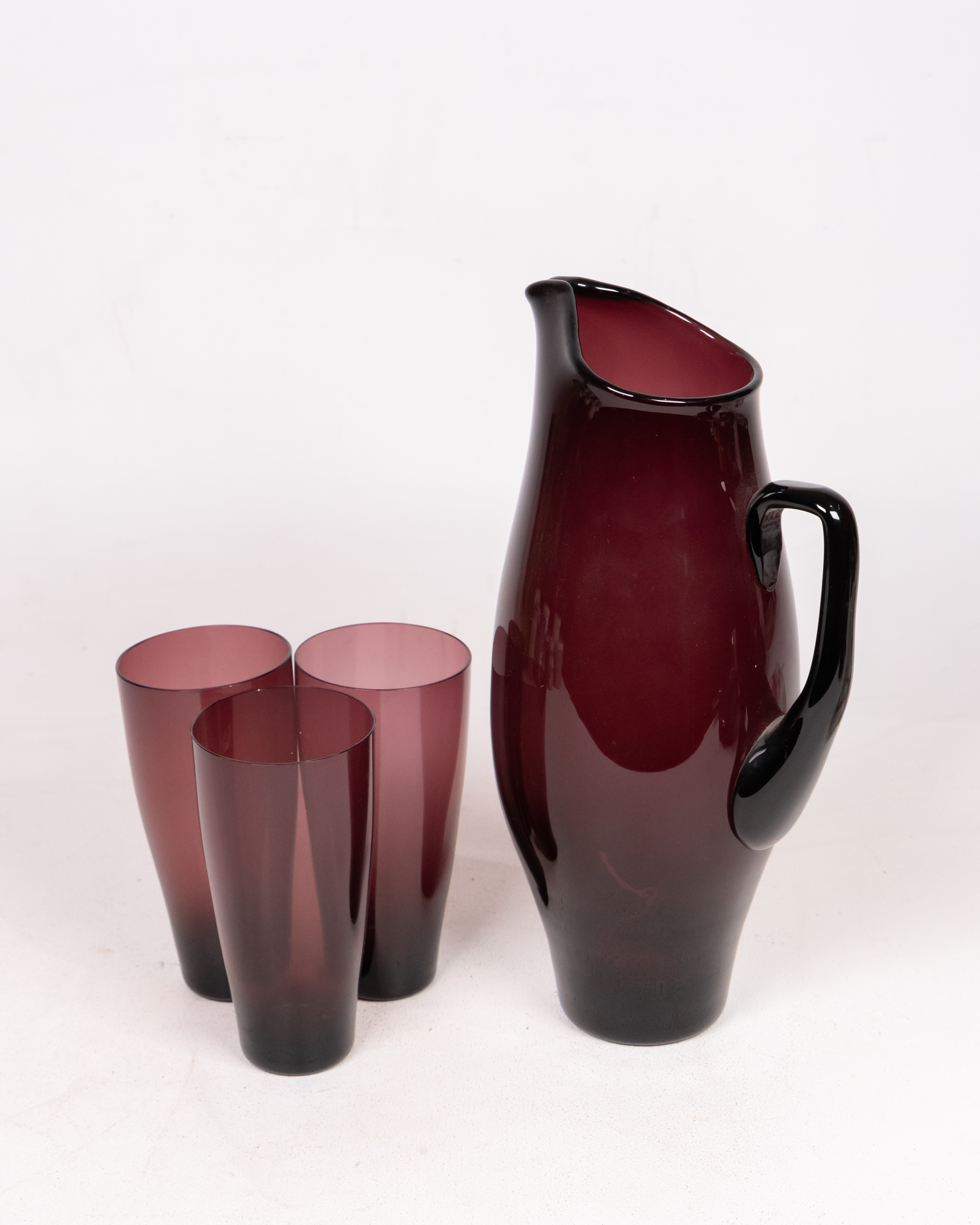 Mid Century Amethyst Glass Pitcher and Pair of Glasses