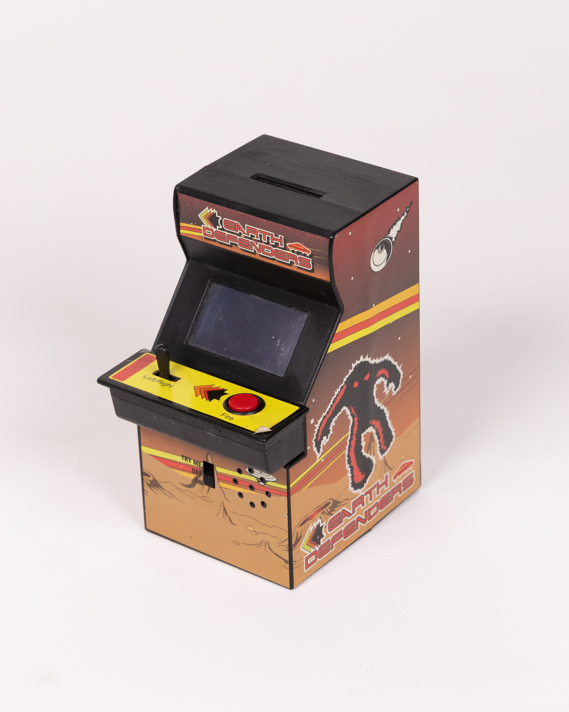 Earth Defenders Arcade Game Novelty Plastic Coin Bank/ Moneybox