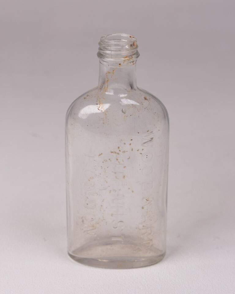 Antique Clear Glass Chemist Bottle with Embossed 'Woodward London'