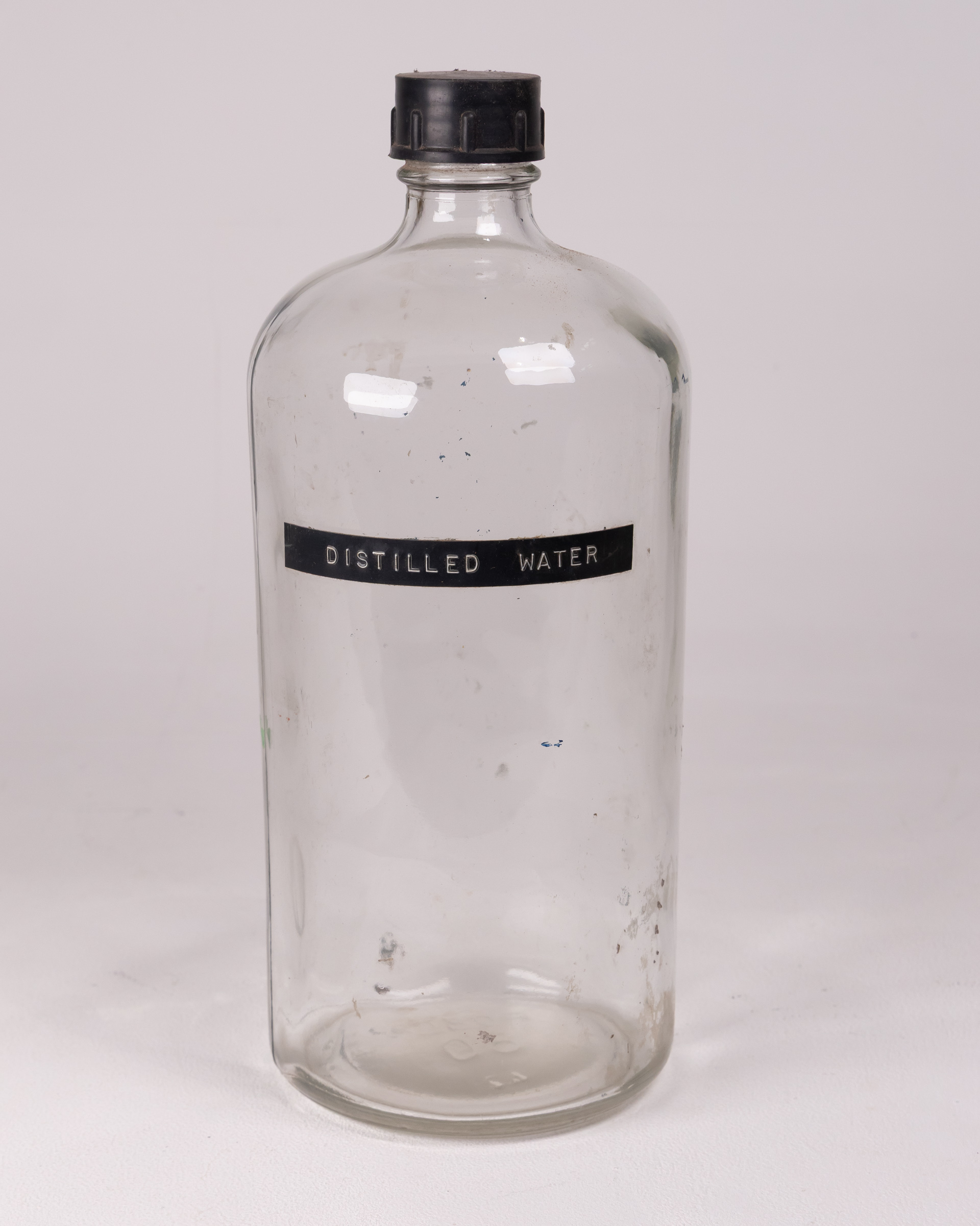 Vintage Distilled Water Bottle, Clear Glass with Black Lid, Collectible