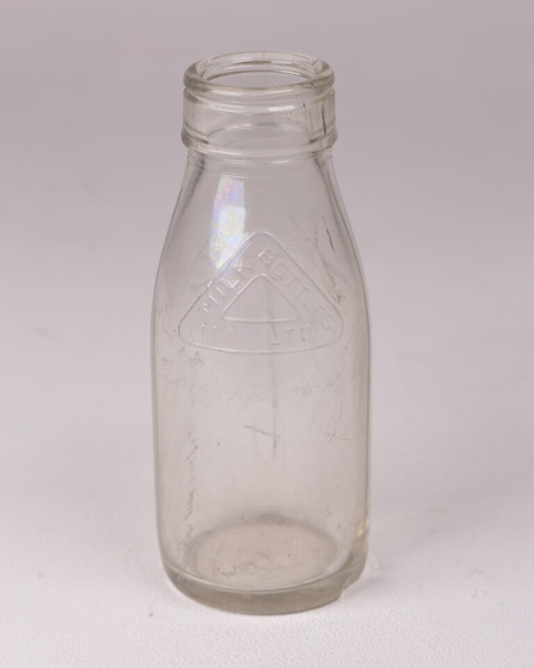 Vintage Clear Glass Milk Bottle with Embossed 'MILK BOTTLES (N.I.) LTD'