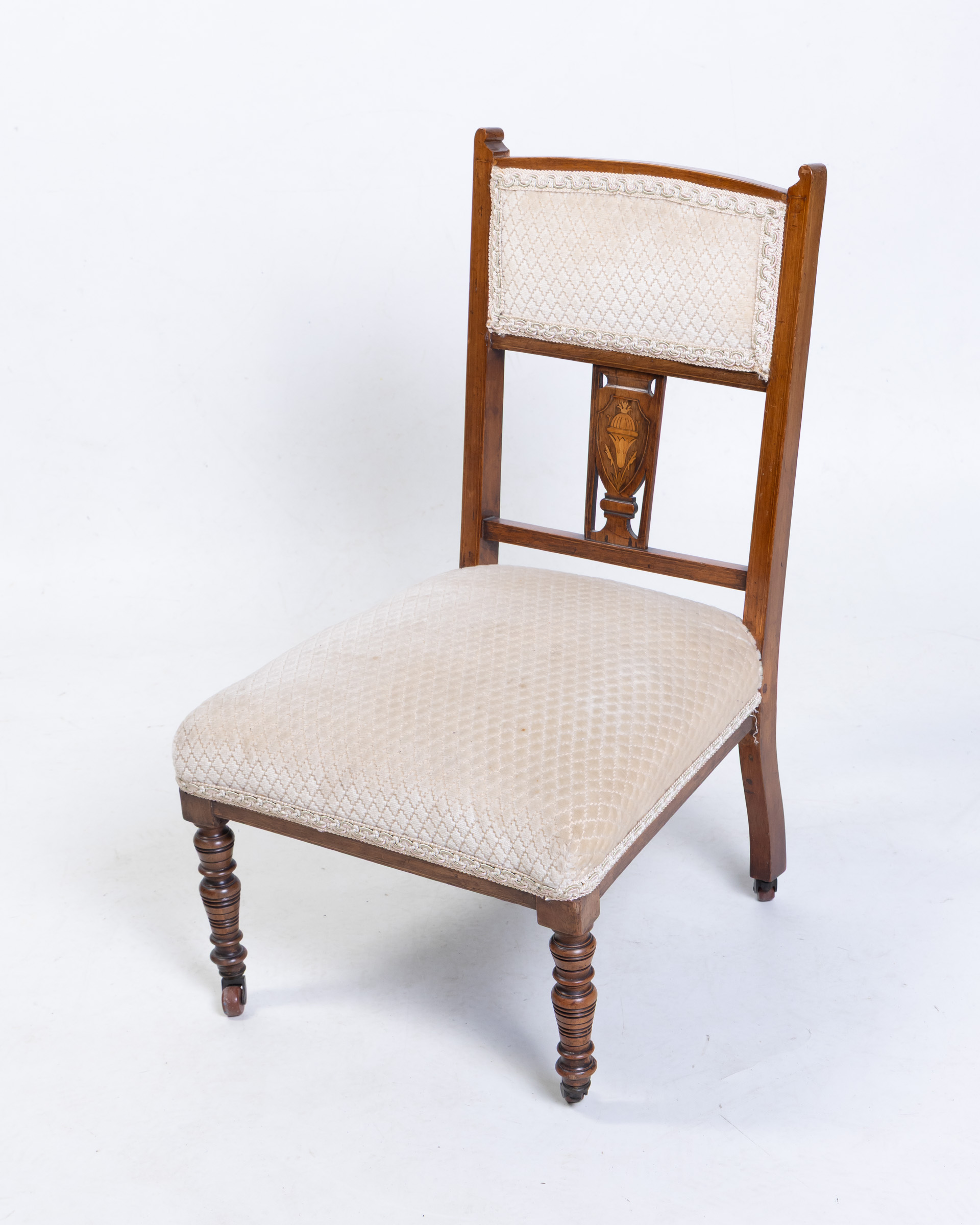 Elegant Bedroom Chair with Cream Upholstery and Carved Wood Details