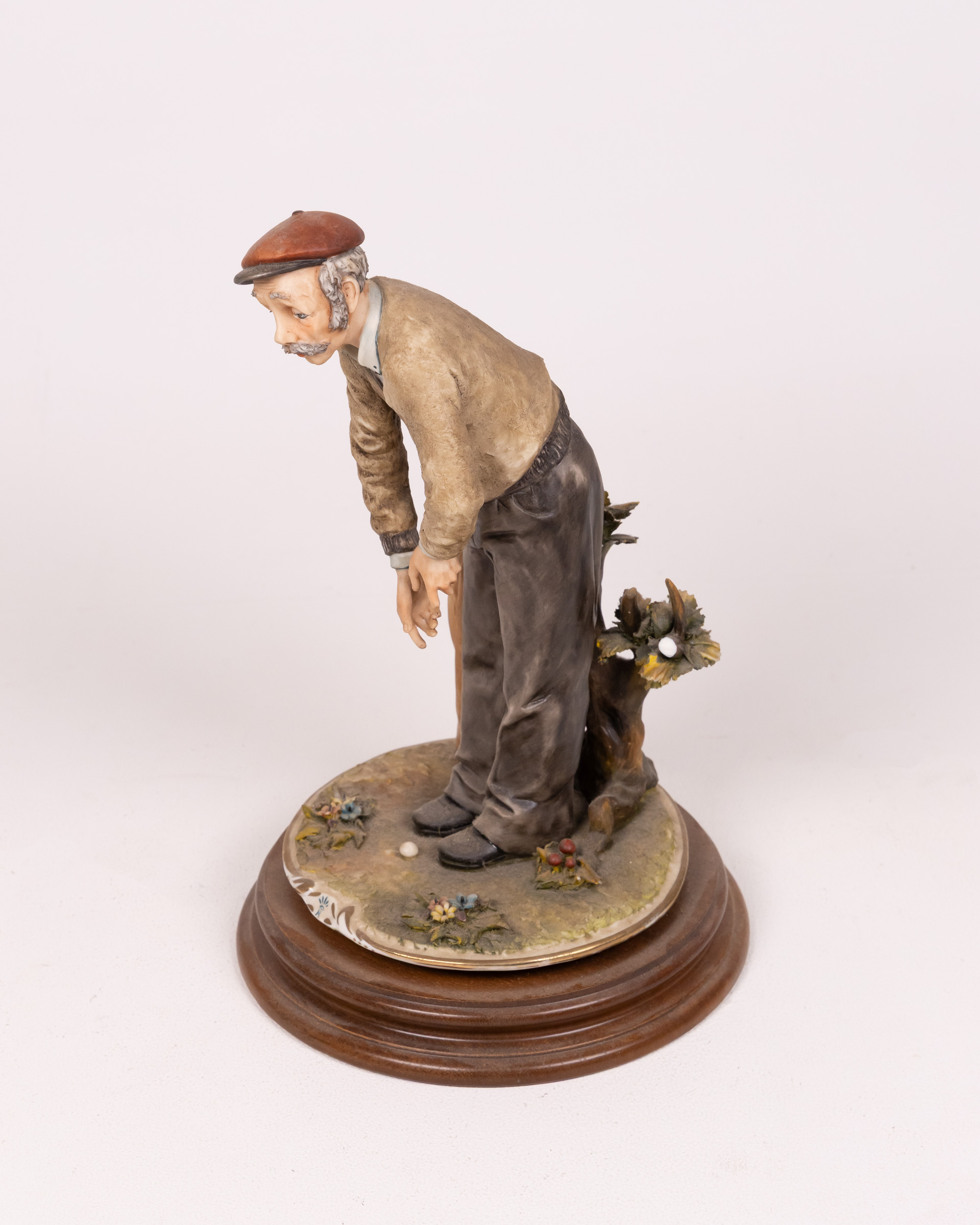 Vintage Porcelain Figurine: Golfer with Clubs on Wooden Base