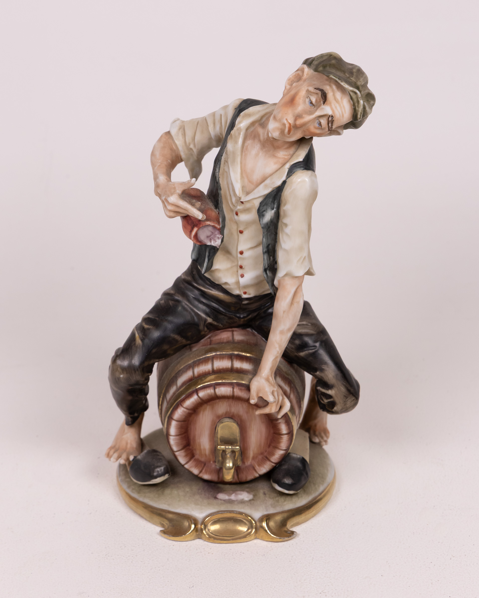 Vintage Ceramic Figurine of a Man Sitting on a Barrel Ornament Decor