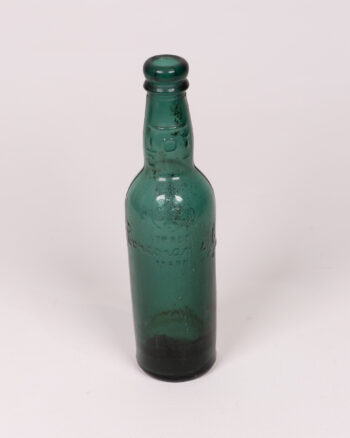 Vintage Green Glass Bottle, Embossed Detail, Collectible Decor, Old Bottle