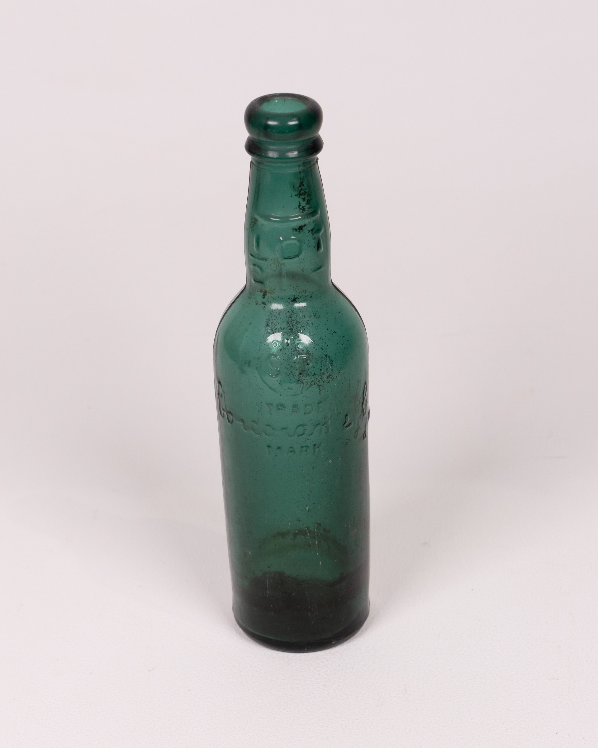 Vintage Green Glass Bottle, Embossed Detail, Collectible Decor, Old Bottle