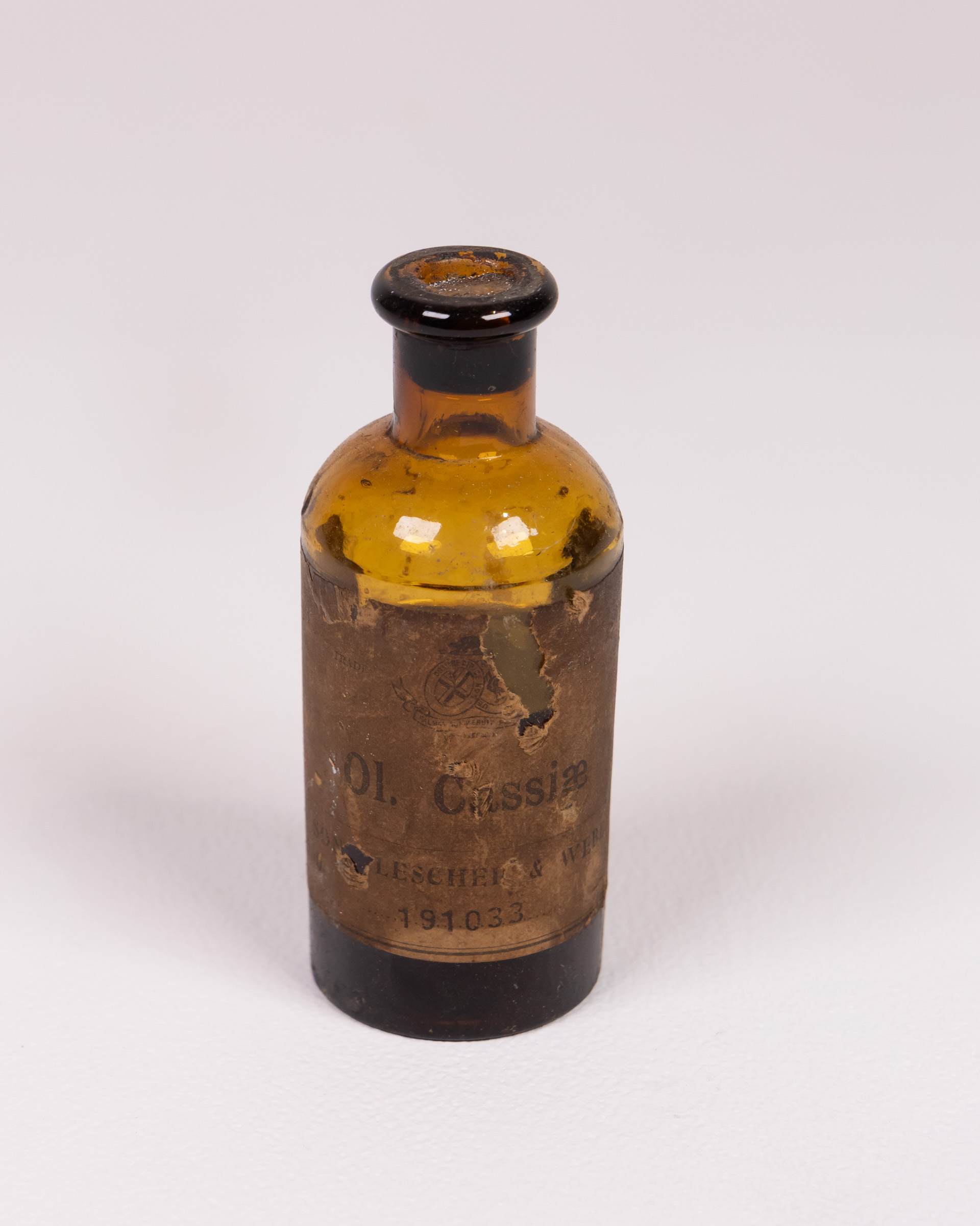 Vintage Glass ‘Ol. Cassiae’ Medical Bottle with Label