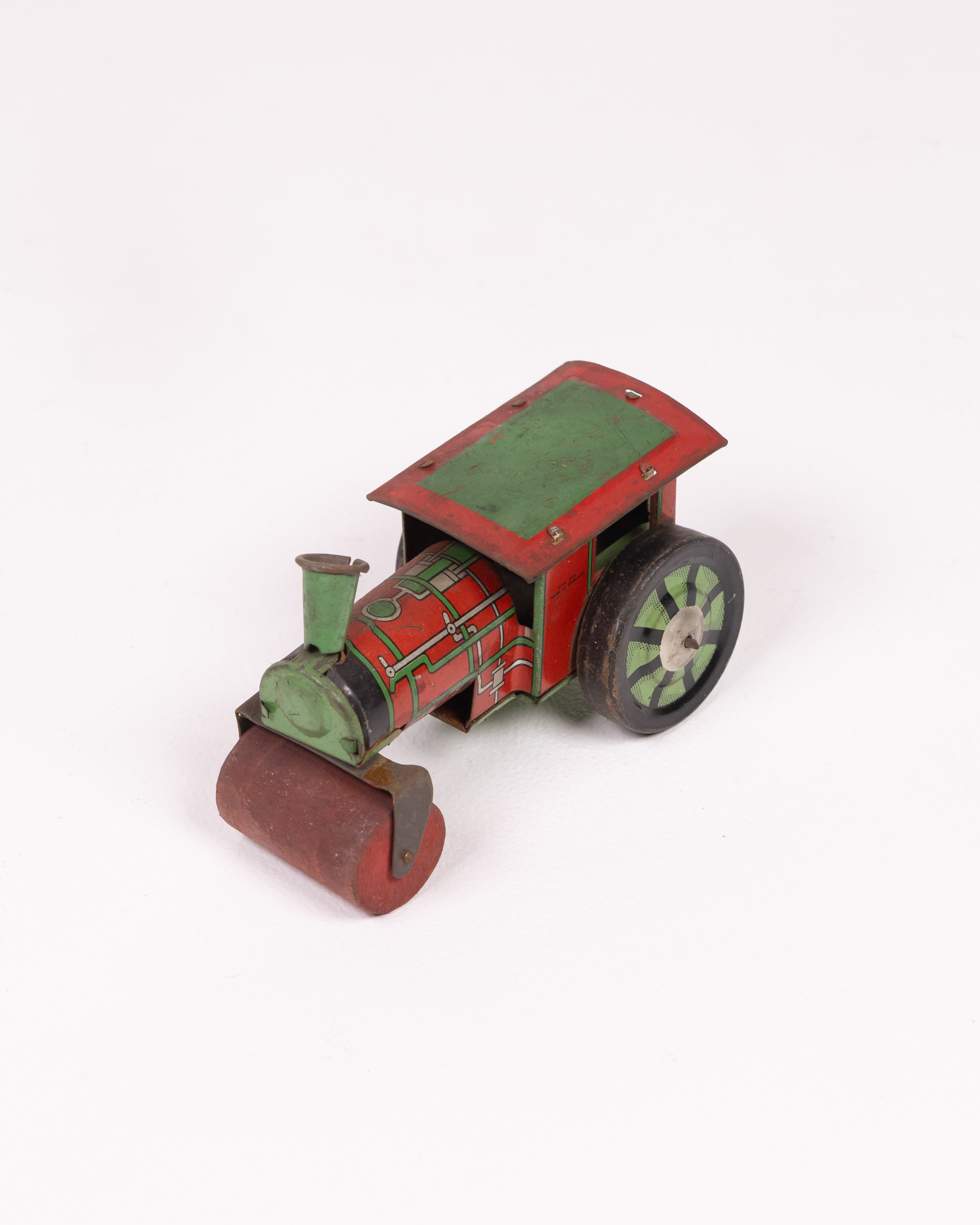 Vintage Tinplate Road Roller Toy with Green Roof