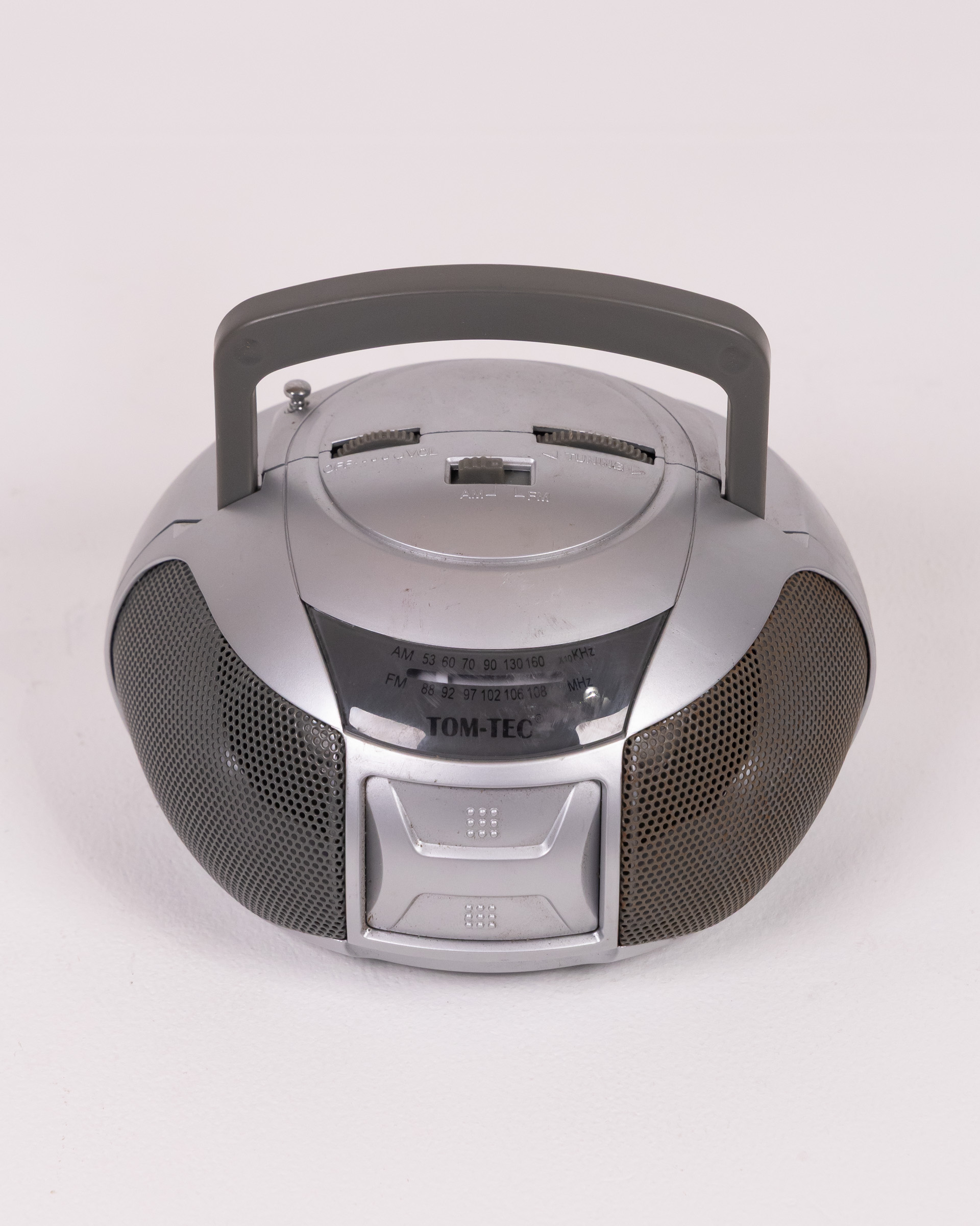 Silver TOM-TEC Radio with Grey Handle