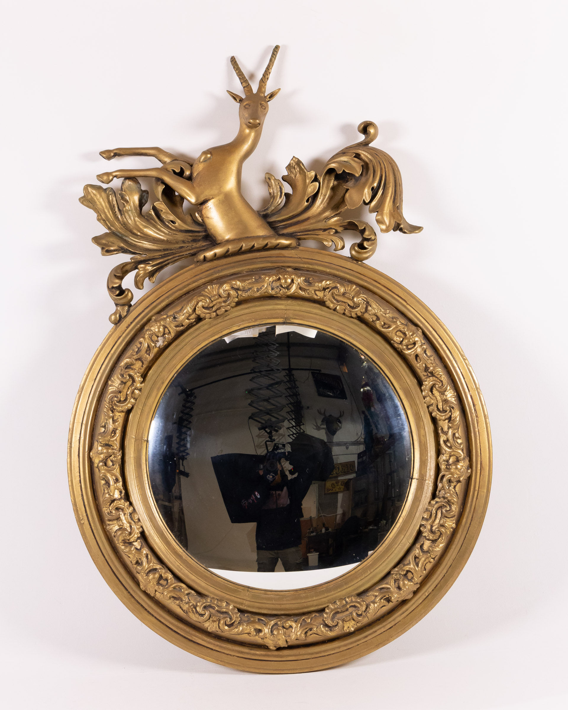 Georgian convex Gold Gilt Wood Round Mirror with Gazelle Decoration