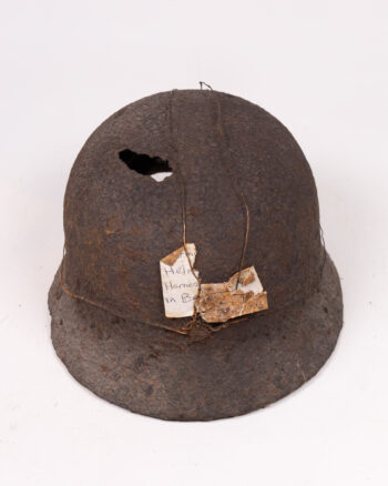 Vintage German M35 Steel Helmet with Battle Damage