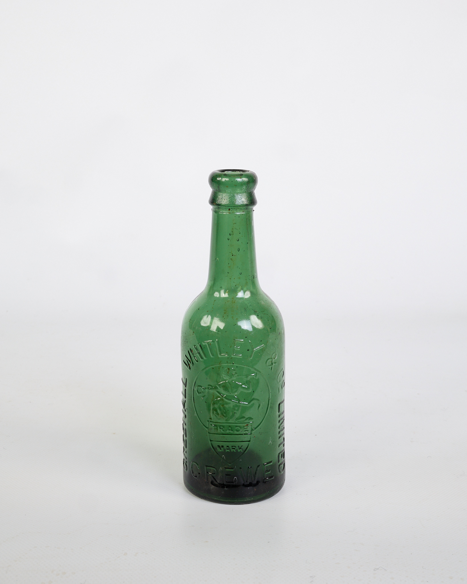 Vintage Green Glass Bottle with Embossed Details