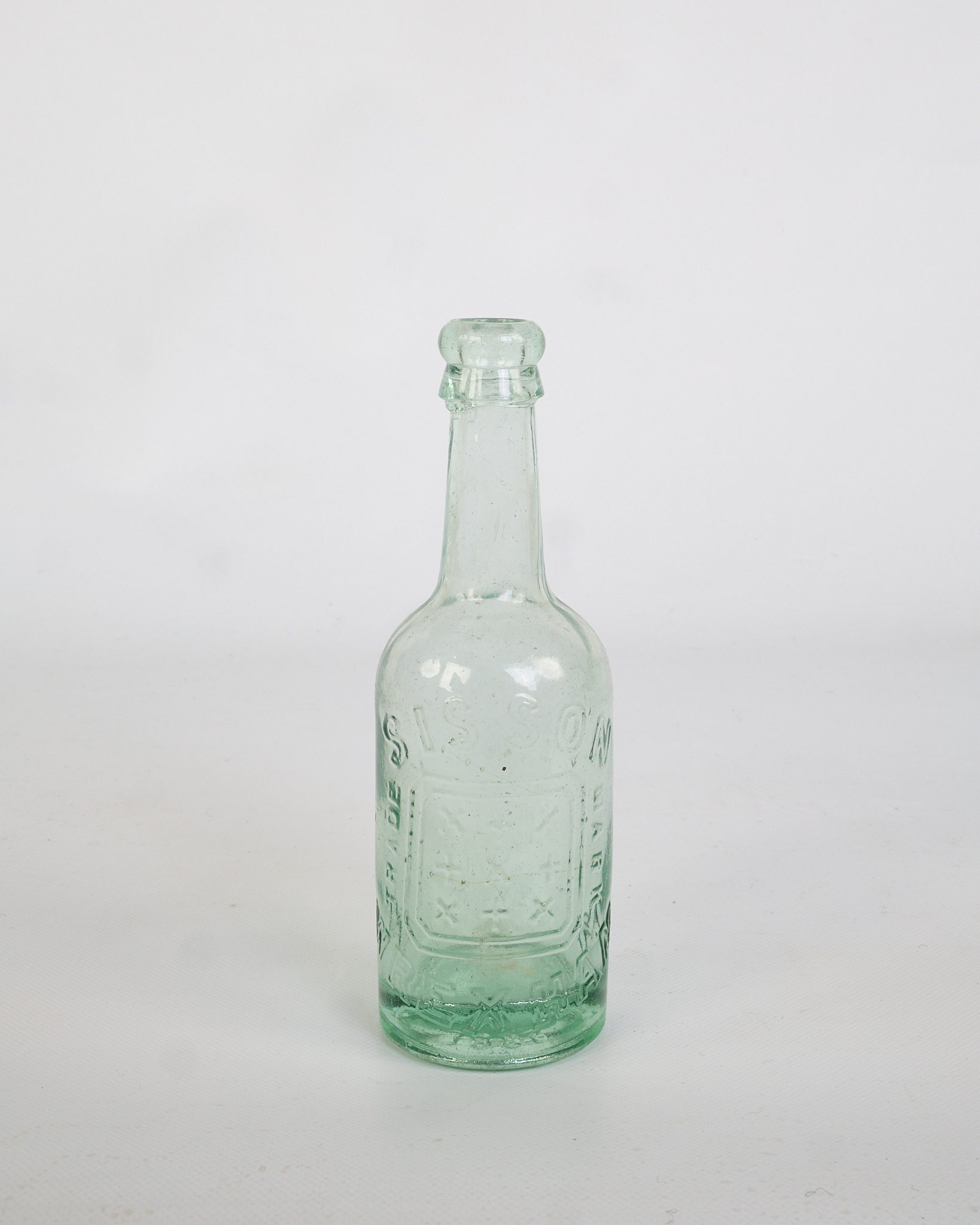 Vintage Green Glass Soda Bottle with Embossed Lettering