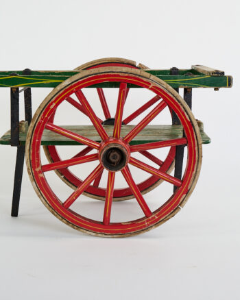 Vintage Wooden Cart with Red Spoked Wheels and Green Paint