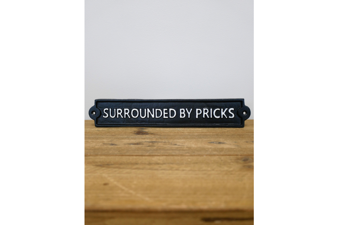 Surrounded By Pricks Cast Iron Sign