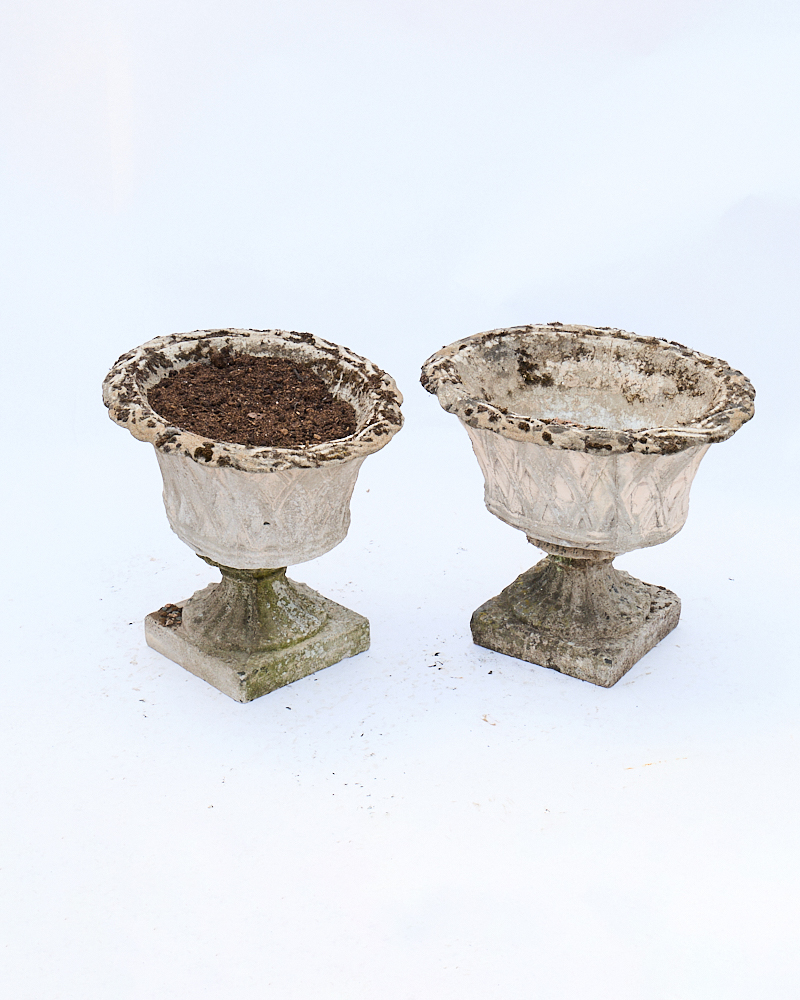 Pair of Weathered Stone Garden Urns with Pedestal Bases