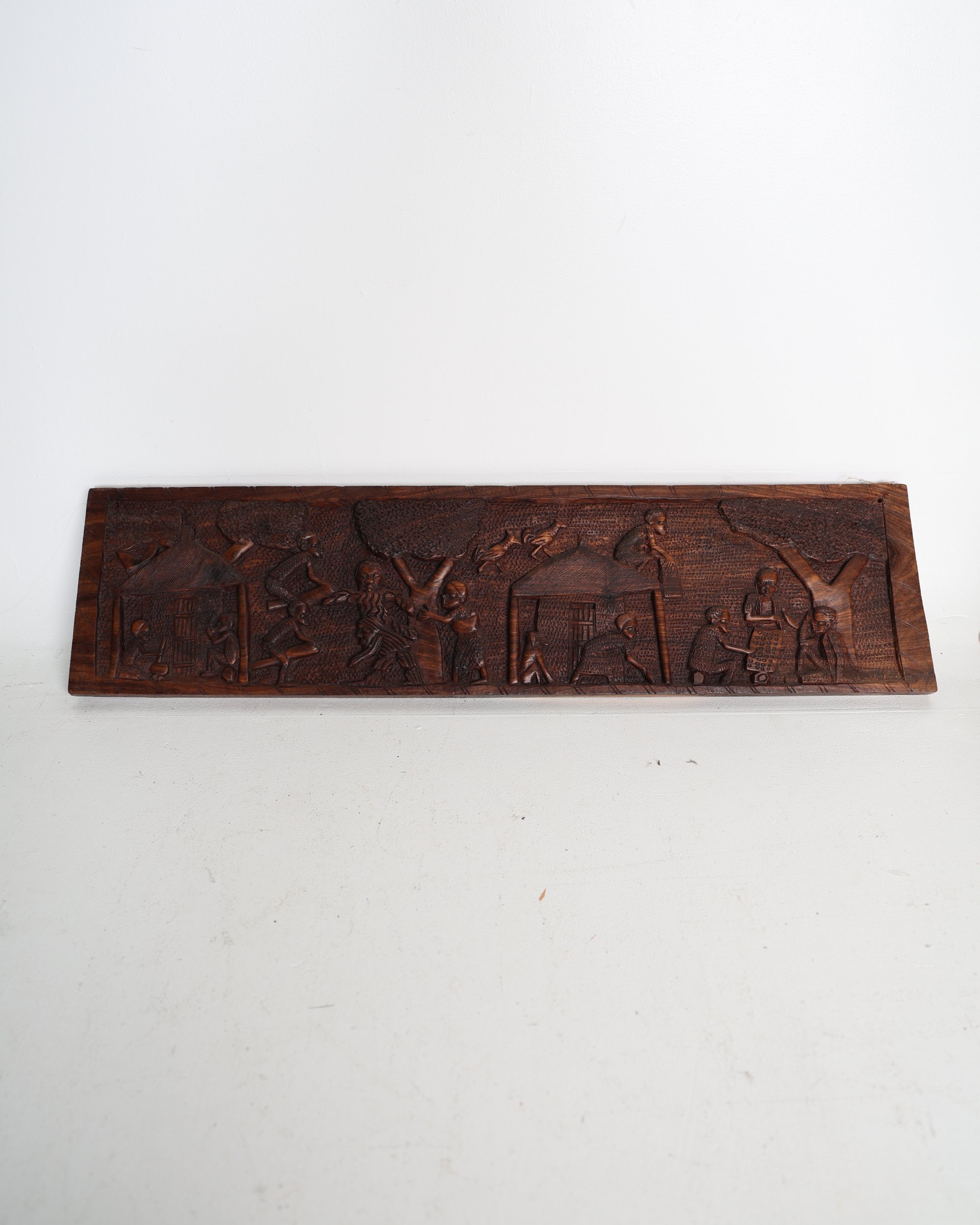 Carved Wood Relief Panel Depicting Village Scenes