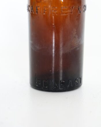 T R Caffrey and Sons Belfast Embossed Brown Glass Bottle