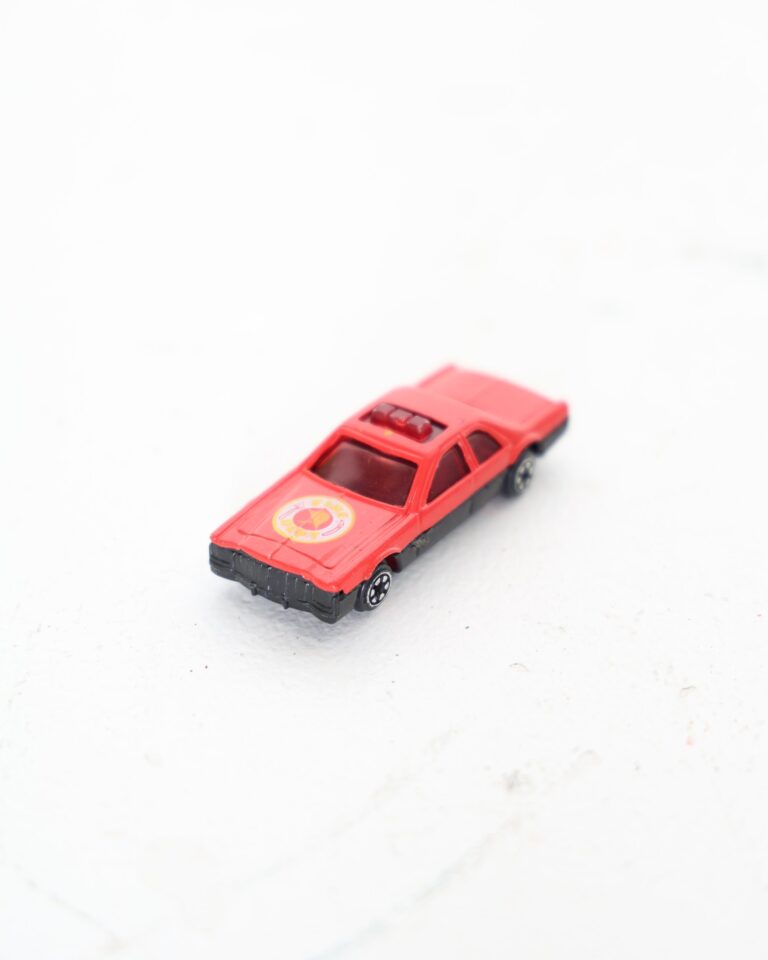 Red and Black Miniature Plastic Toy Fire Department Car