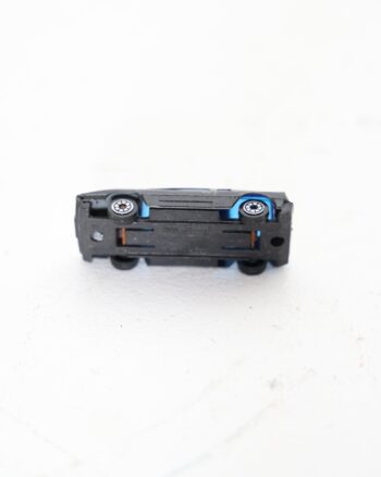 Miniature Black Diecast Toy Car with Blue Windows