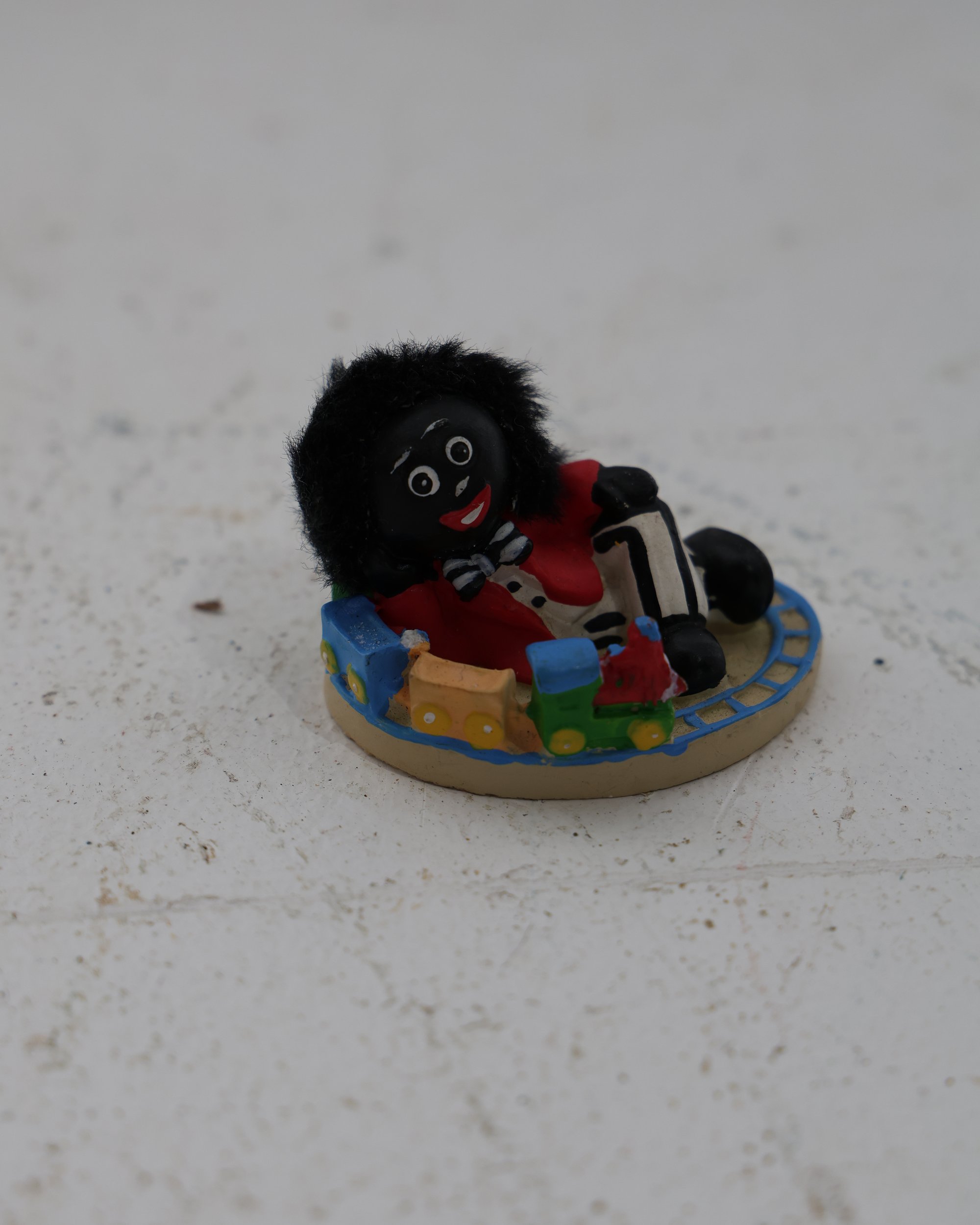Golly Collectable Figurine on Train Track