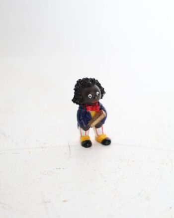 Small Golly Figurine Holding a Golden Book
