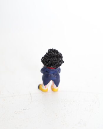 Small Golly Figurine Holding a Golden Book
