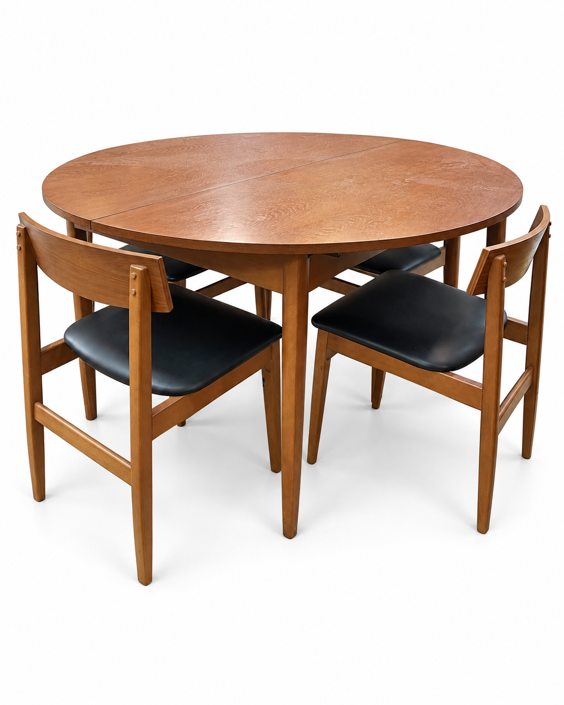 Round wooden dining table with four chairs