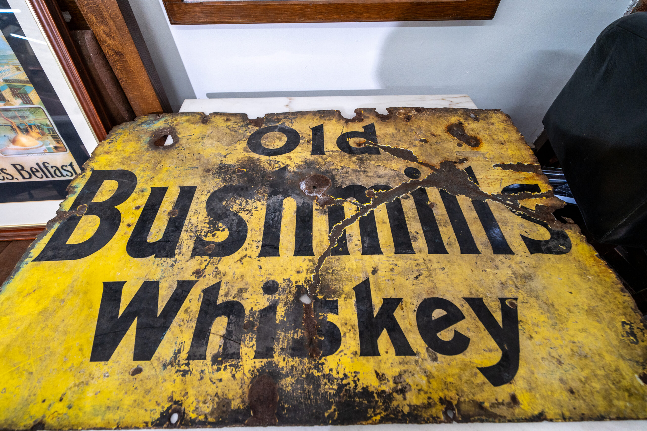 Weathered Old Bushmills Whiskey advertising sign